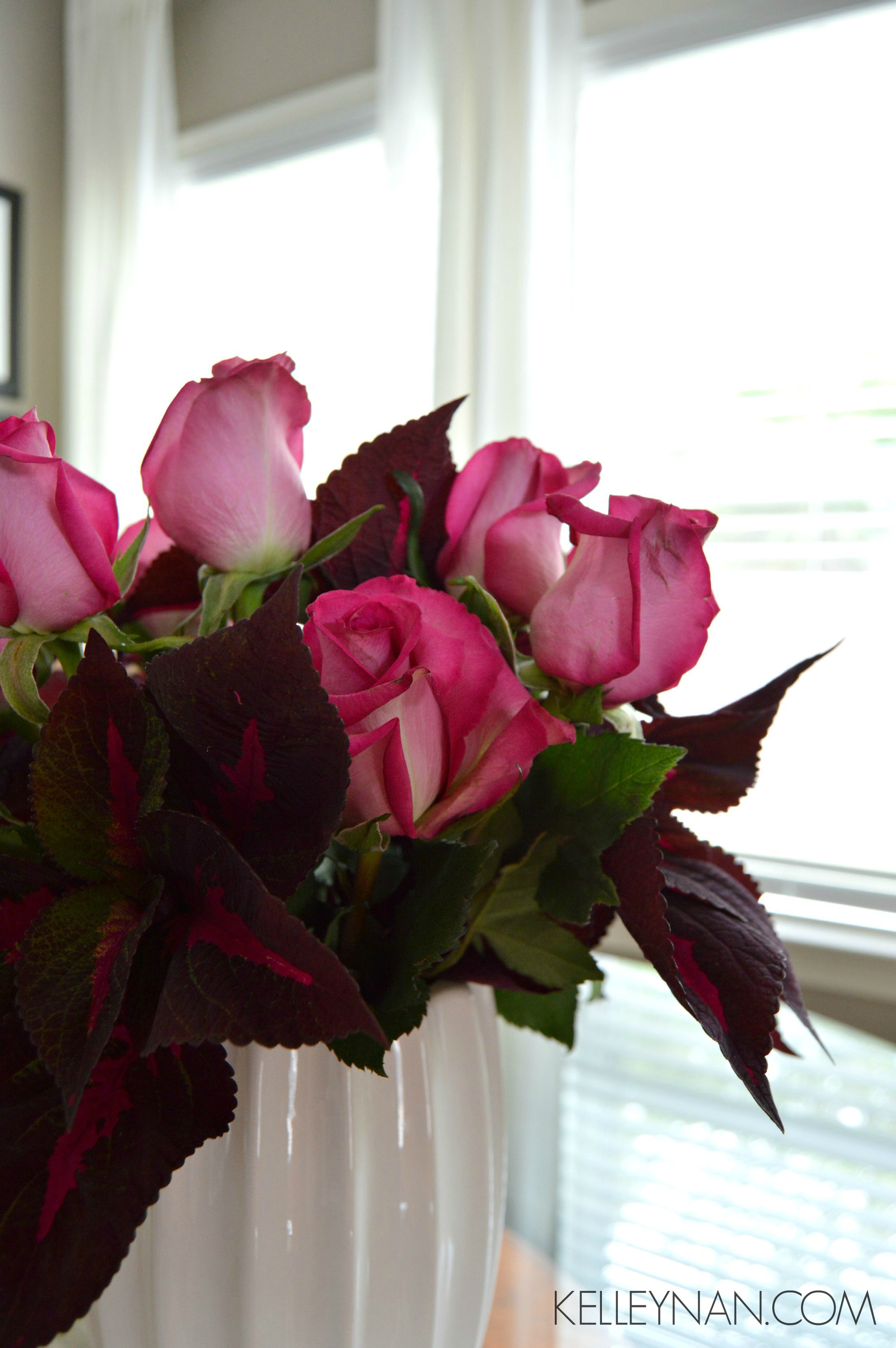 Red coleus and pink roses in the breakfast nook