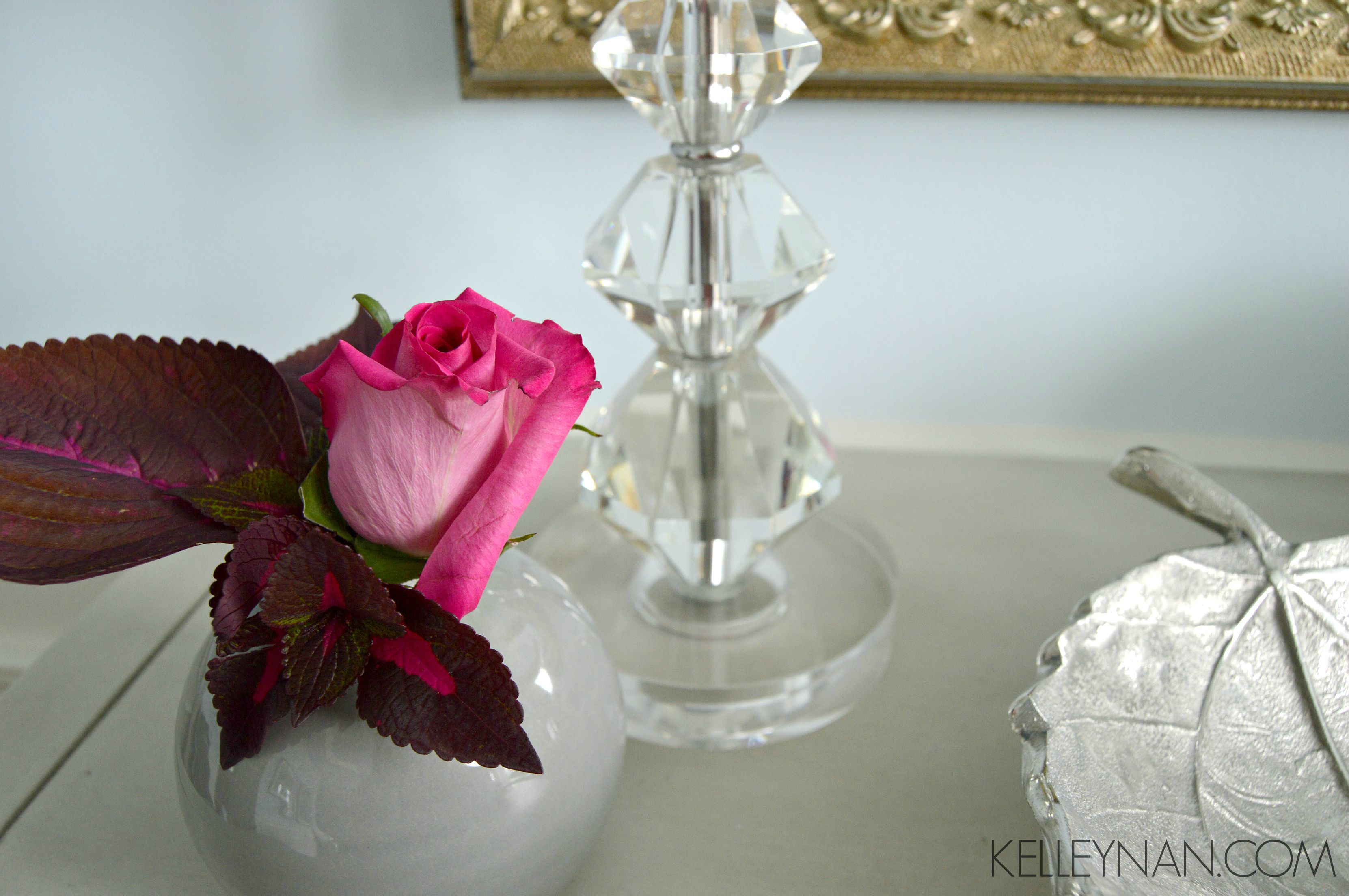 Red coleus and pink rose bud in the formal dining room