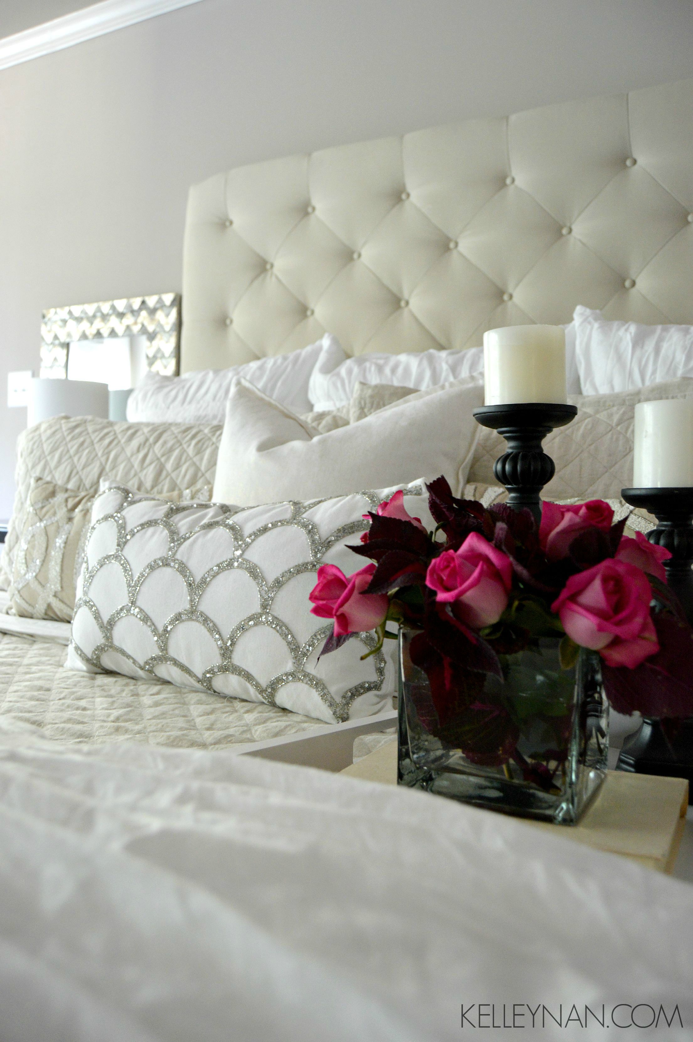 Red coleus and pink roses in white and neutral master bedroom