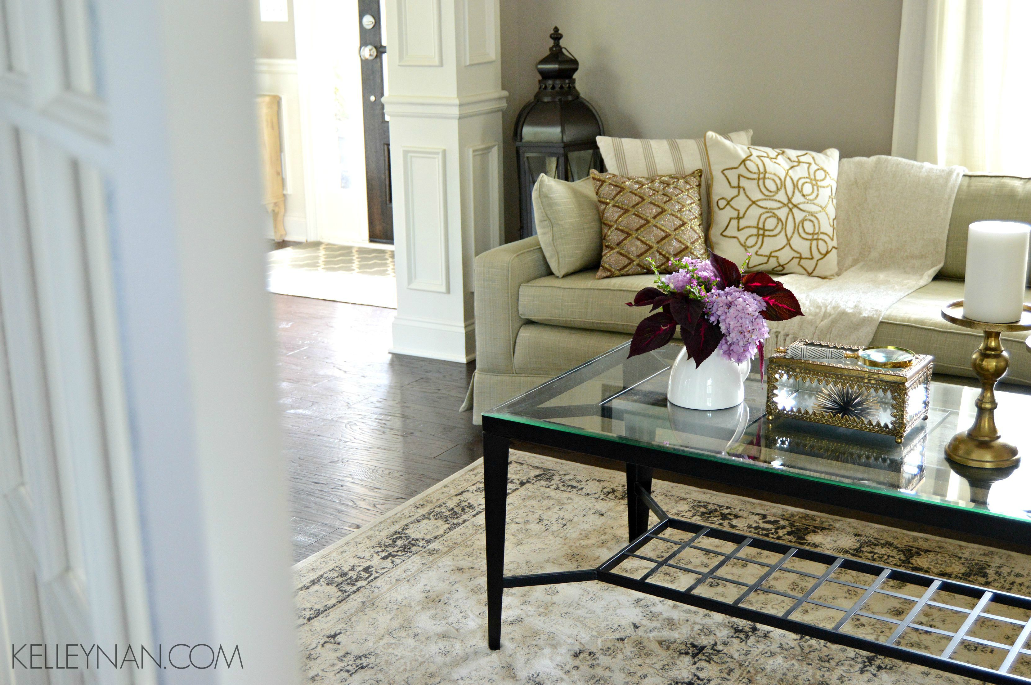 Formal living room with red coleus and purple hydrangeas