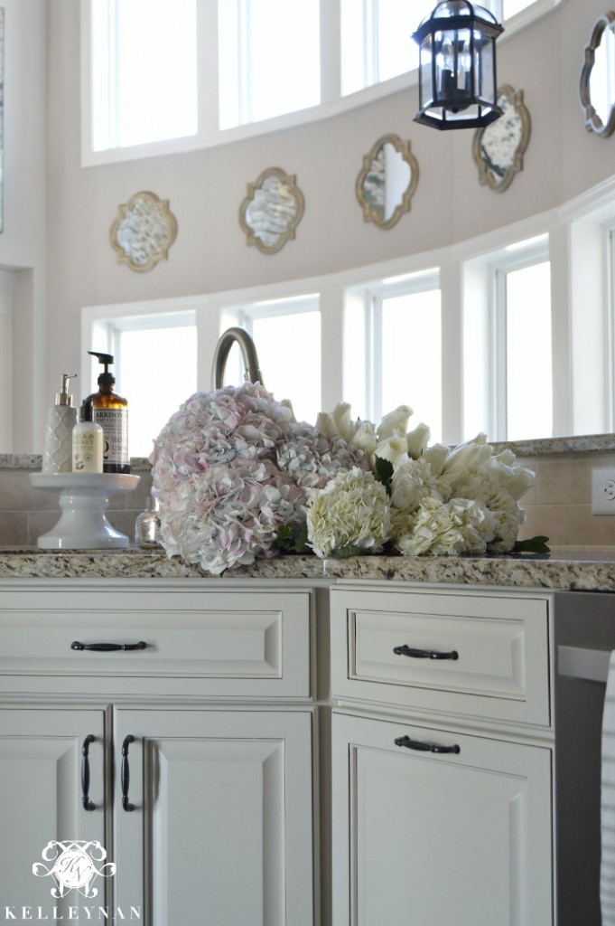 Flowers and Hydrangeas in Sink in Neutral Kitchen