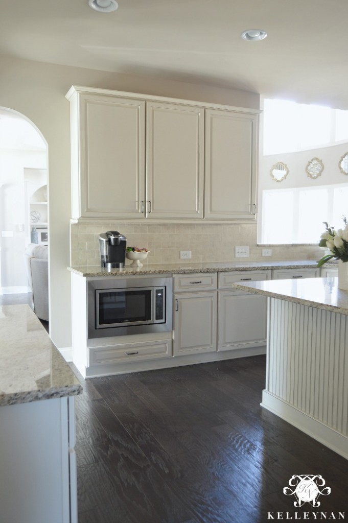 Microwave Low in White Kitchen Dark Floors