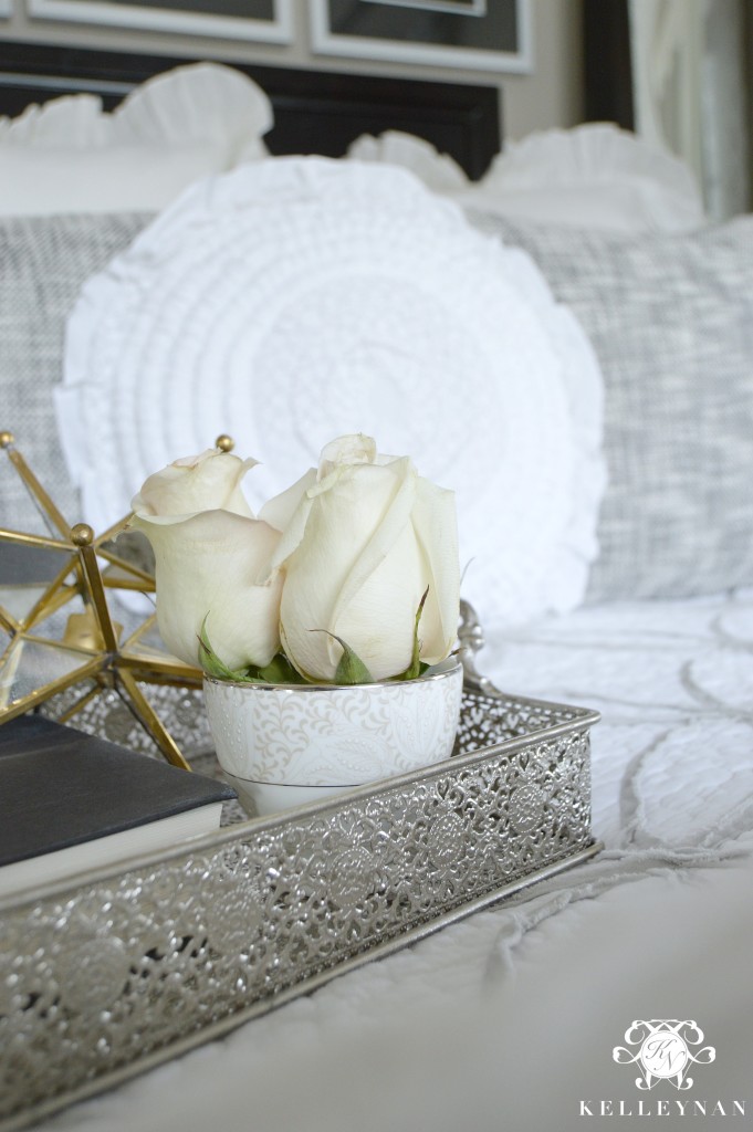 Decorative tray on bed