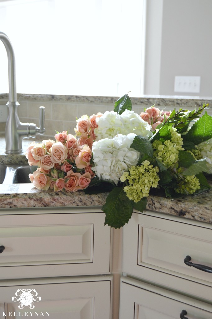 Roses and hydrangeas in a sink