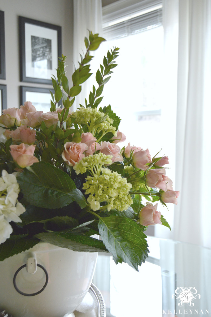 White hydrangea and pink rose arrangements in Pottery Barn Rhodes Ice Bucket