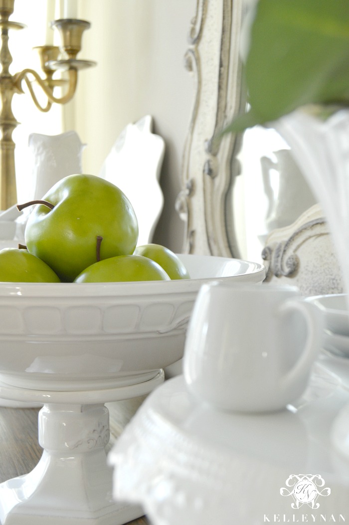 Green Apples with White Serveware on Buffet Sideboard
