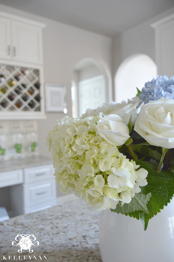 White Blue and Green Floral Arrangement in White Kitchen