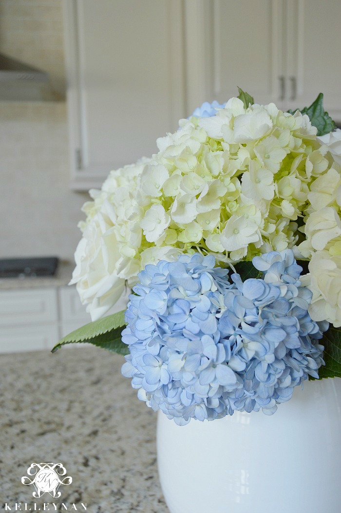 blue and white hydrangea arrangement in kitchen