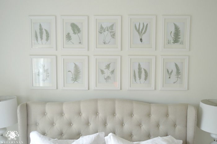 Botanical Art Gallery Wall Above Tufted Bed