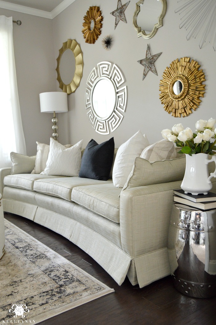 Gold and Silver Sunburst Gallery Wall in Formal Living Room