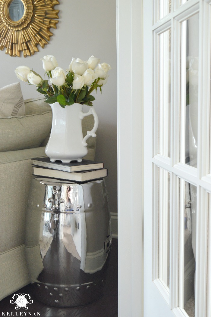 Silver Mirrored Garden Stool with Books and White Pitcher of Roses