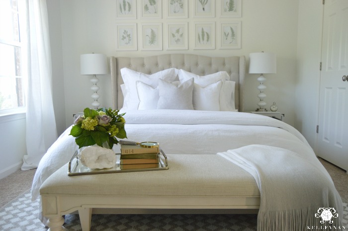 White Guest Bedrom with Gallery Wall Behind Bed