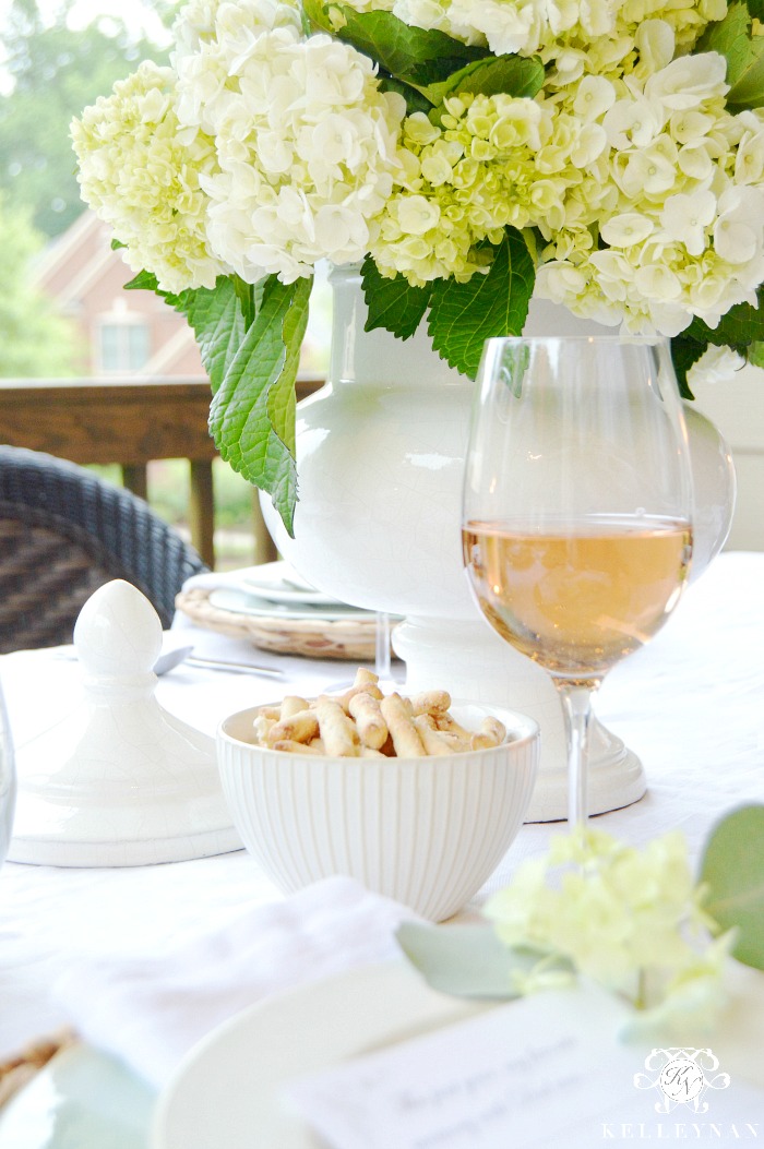 Table for Pottery Barn with White Jar and Hydrangeas and Rose
