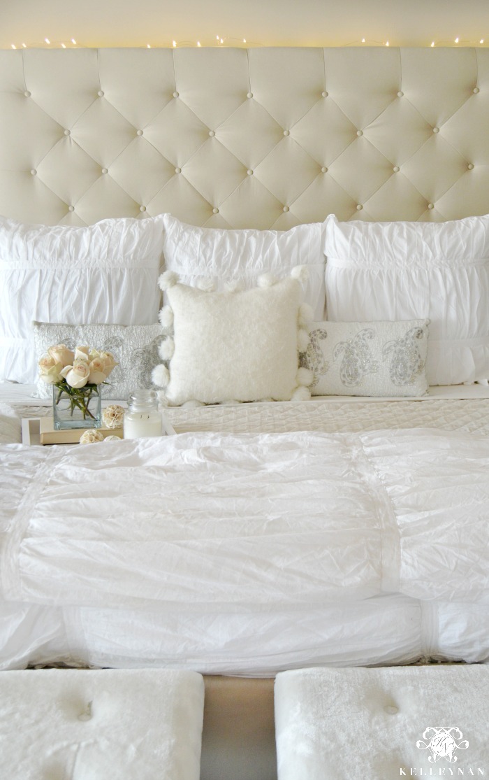 Winter Tufted Bed with White Wool Pom Pom pillow