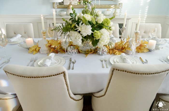 Fall Table Setting Tablescape with White Centerpiece and Gold Leaves for Garland