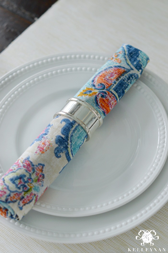 White Beaded Dinnerware with Colorful Napkin and Silver Napkin Ring