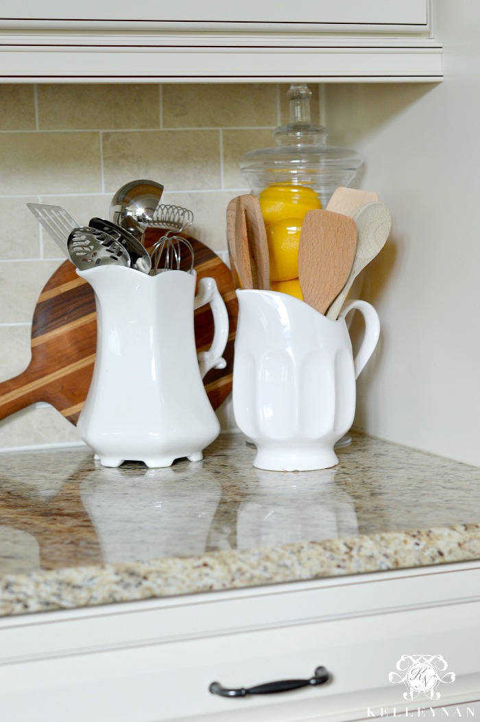 White Pitchers in Kitchen with Utensils