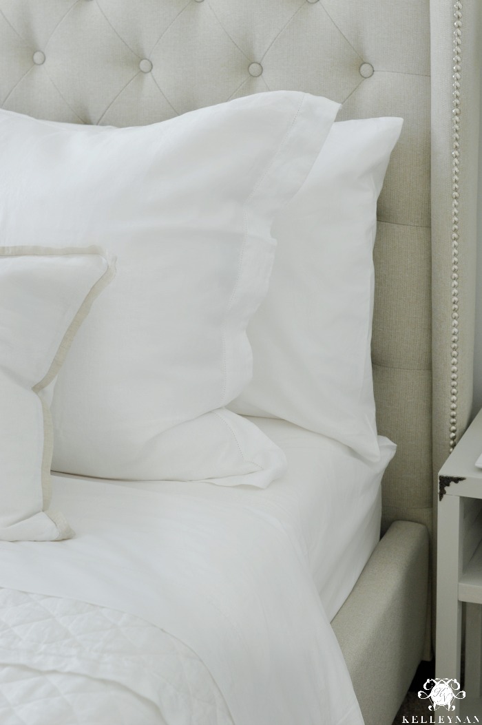 White Sheets in Guest Bedroom with Tufted Headboard