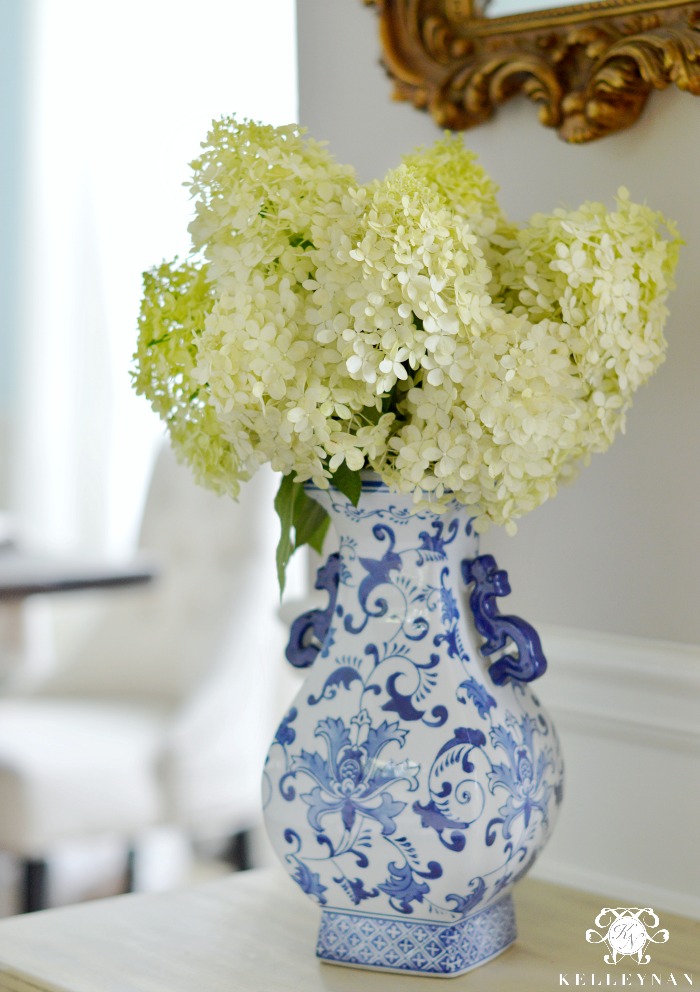 blue and white vase with limelight hydrangeas