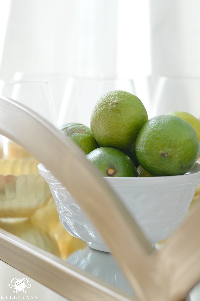 bowl-of-limes-on-gold-bar-cart