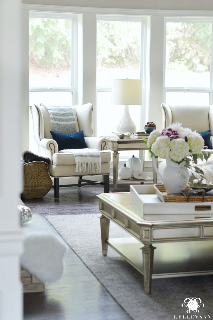 living-room-with-pottery-barn-thatcher-wing-back-chairs-for-fall-with-navy