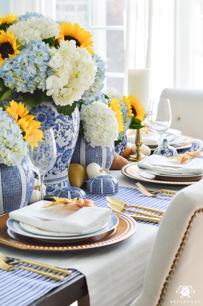 Rustic Table Decor with Wine Bottles, Roses, and Hydrangeas at The  Enchanted Barn