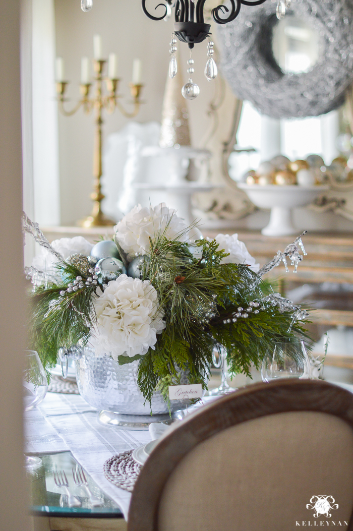 Christmas dinner table decorations in blues and gold following a