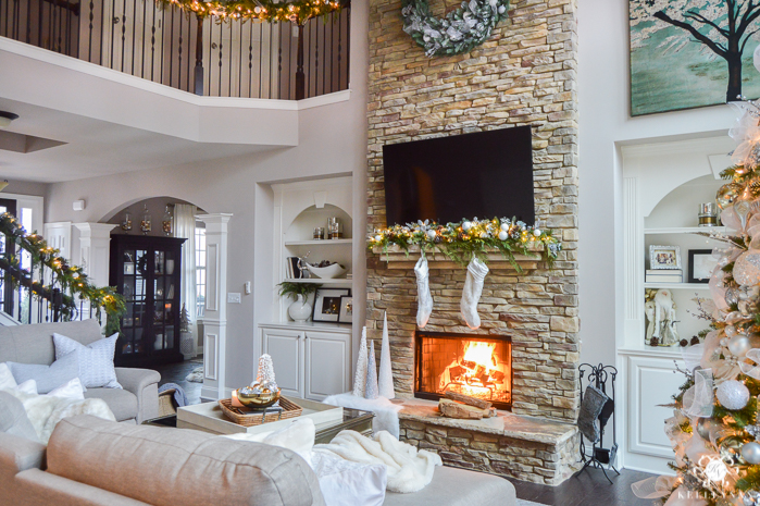 two-story-christmas-great-room-with-stacked-stone-fireplace-and-big-christmas-tree