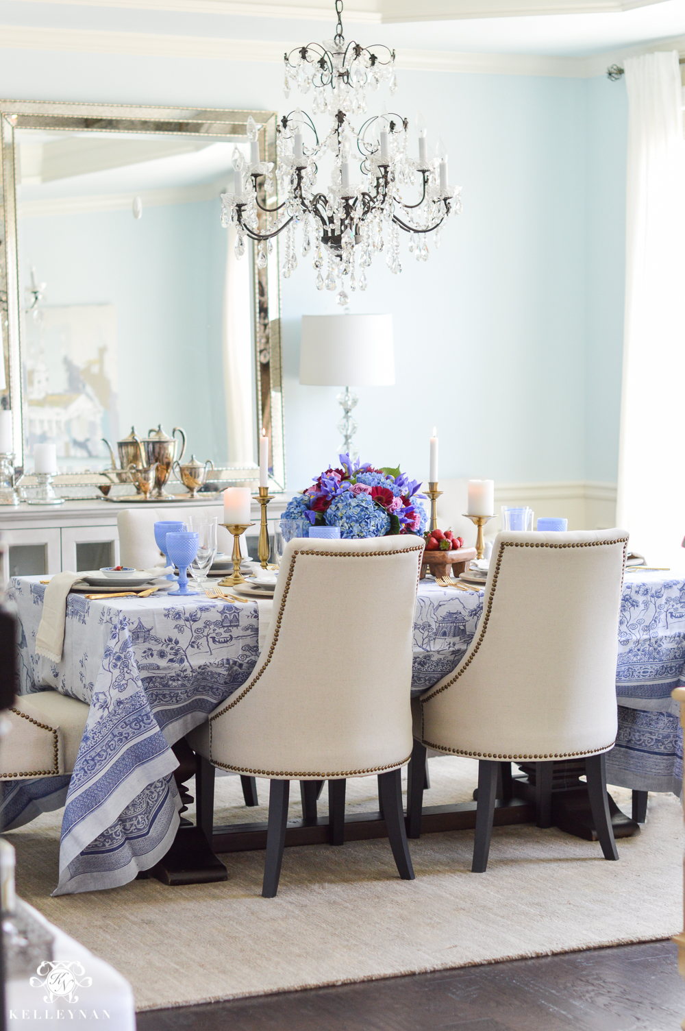 Blue dining room with crystal chandelier