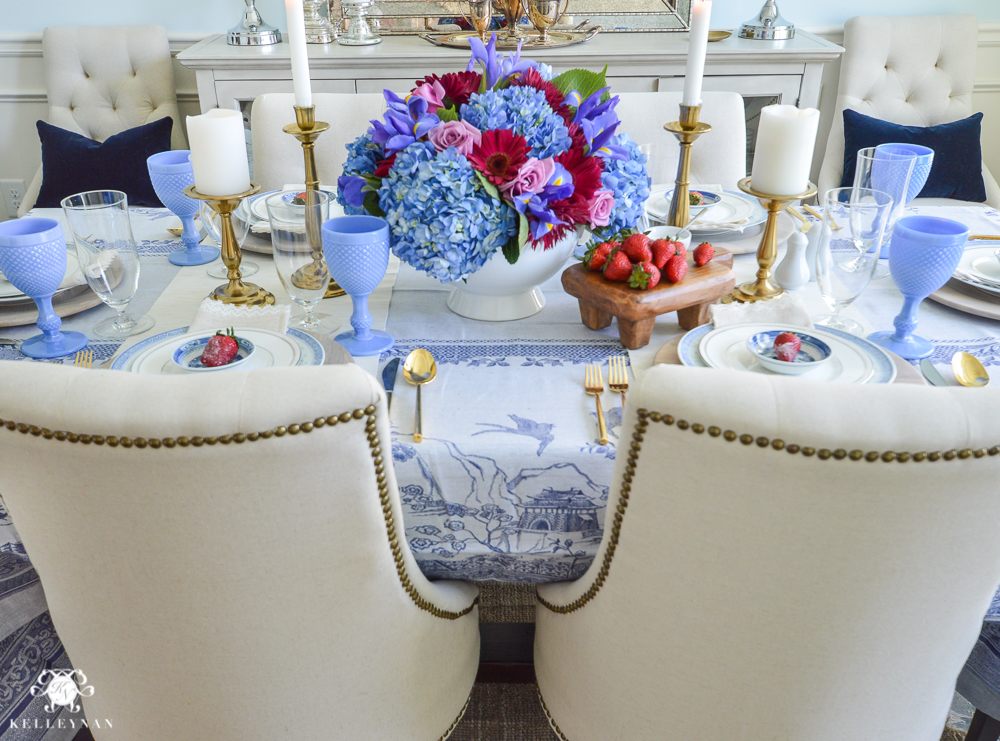 Jewel tone floral arrangement with linen lydia chairs