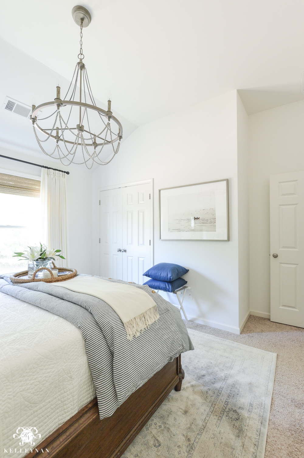 One Room Challenge Blue and White Guest Bedroom Reveal Before and After Makeover guest bedroom with chandelier from vaulted ceiling