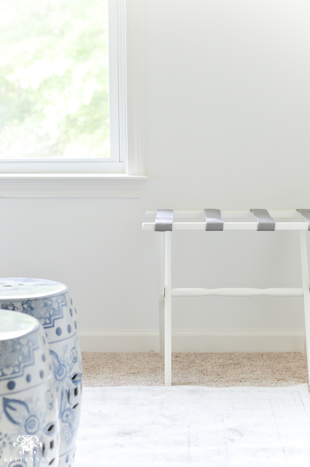 One room challenge week 4 blue and white guest bedroom gray and white luggage rack and blue and white garden stools