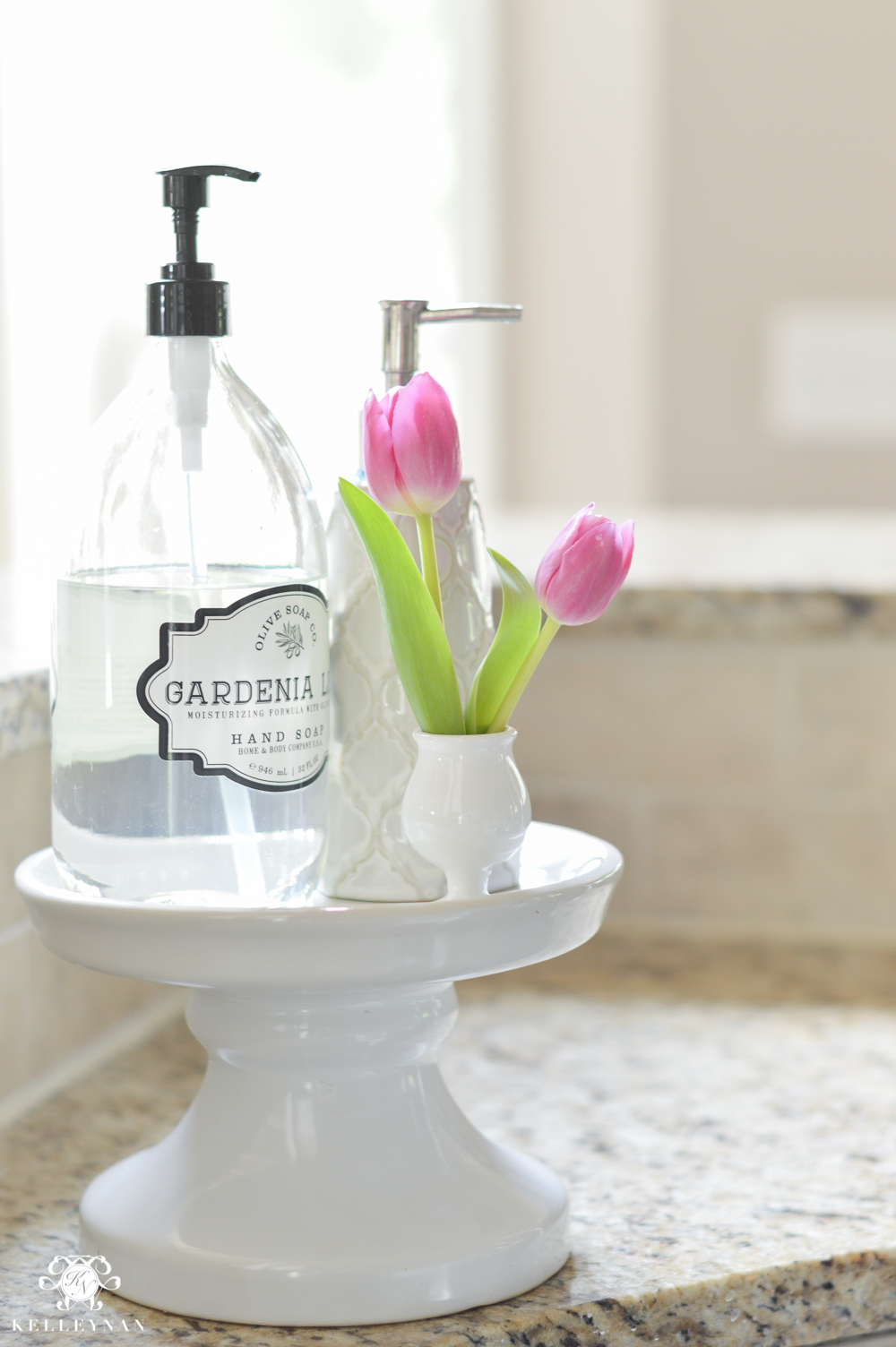 Shades of Summer Home Tour with Neutrals and Naturals-beverage tub stand for soap holder next to sink with bud vase of tulips