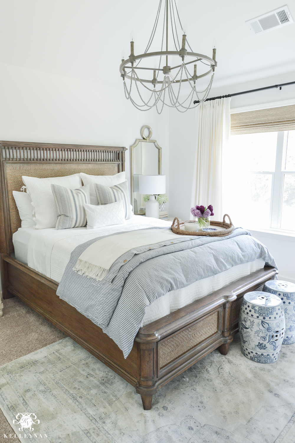 Shades of Summer Home Tour with Neutrals and Naturals-blue and white guest bedroom with cane bed and Sherwin Williams Alabaster Paint