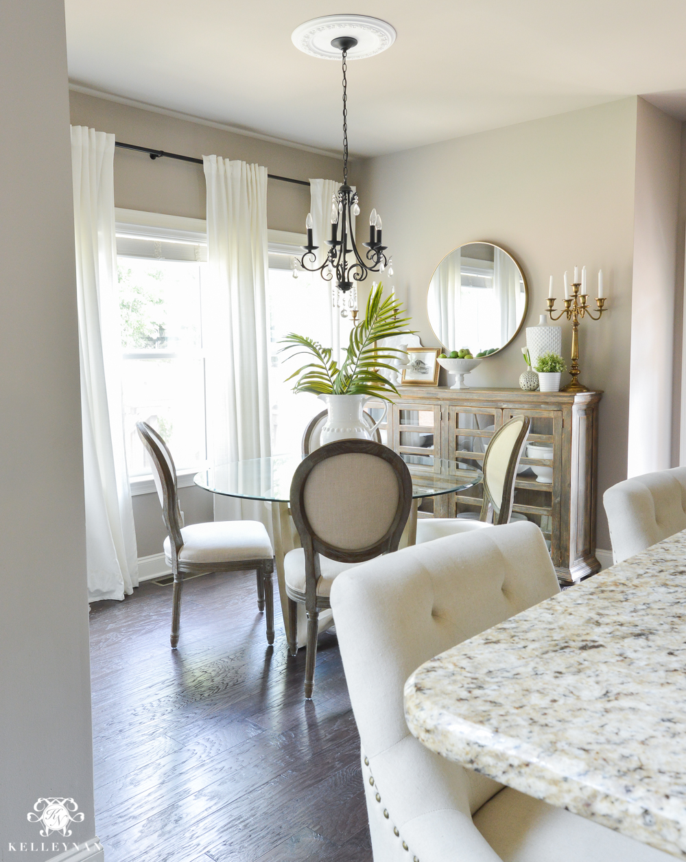 Shades of Summer Home Tour with Neutrals and Naturals- breakfast nook with white ikea ritva curtain panels and palm leaf arrangement