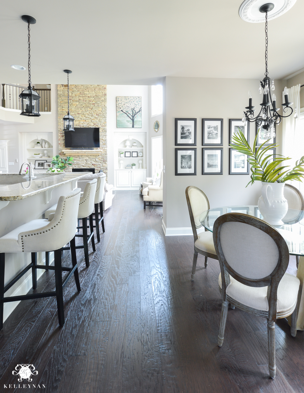 Shades of Summer Home Tour with Neutrals and Naturals-kitchen nook with bar stools and black and white gallery wall
