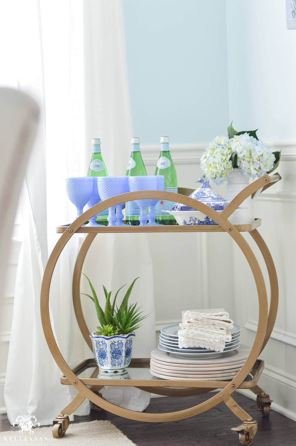Shades of Summer Home Tour with Neutrals and Naturals- world market asher bar cart in blue dining room