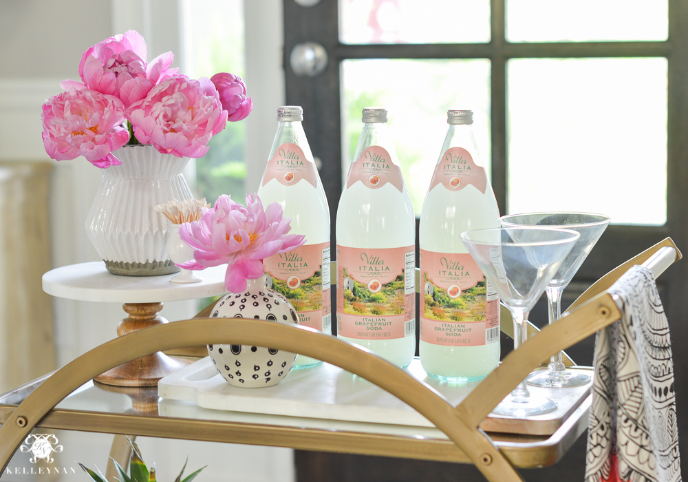 Easy Tropical Bar Cart with Peonies and Pineapple- bar cart setup in foyer