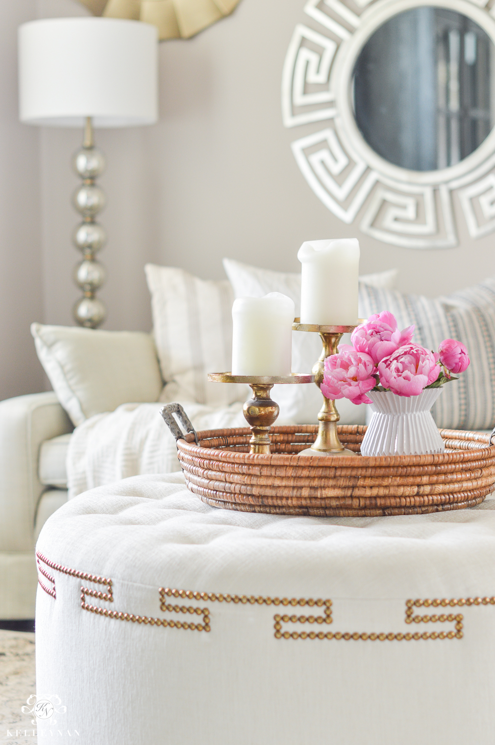 Greek key ottoman with tray and pink peonies