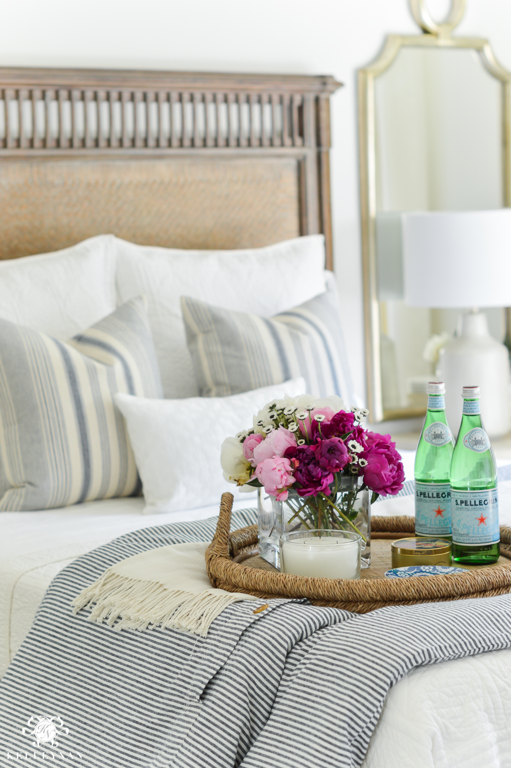 Guest Room Essentials- What every guest bedroom should have- blue and white bedding with pink and white peonies