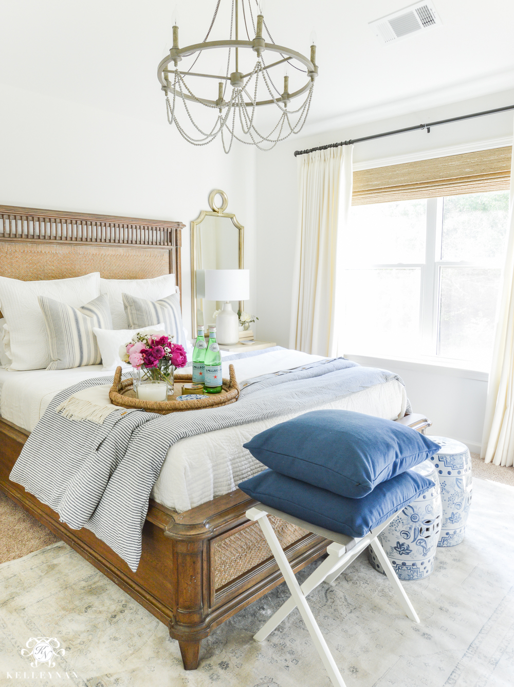 Guest Room Essentials- What every guest bedroom should have- blue and white guest bedroom with chandelier