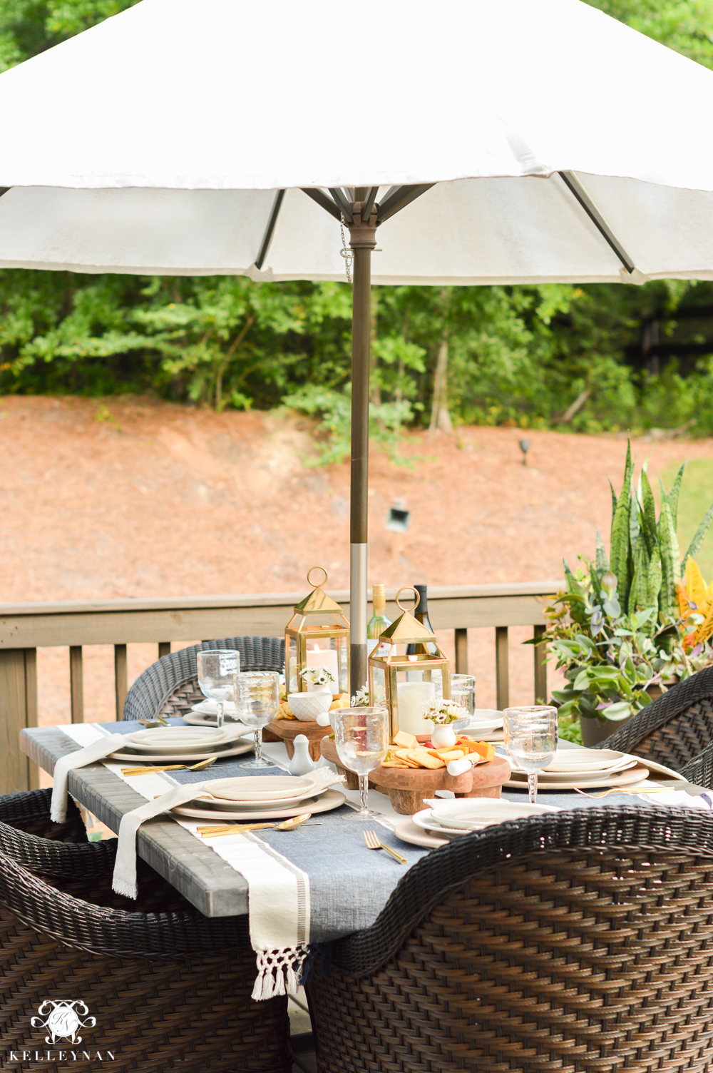 Outdoor Entertaining and Table Ideas with Cheese board appetizer centerpieces- outdoor dining under umbrella