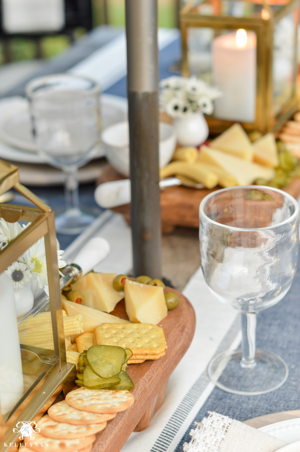 Outdoor Entertaining and Table Ideas with Cheese board appetizer centerpieces- wooden paddle boards as outdoor table centerpieces