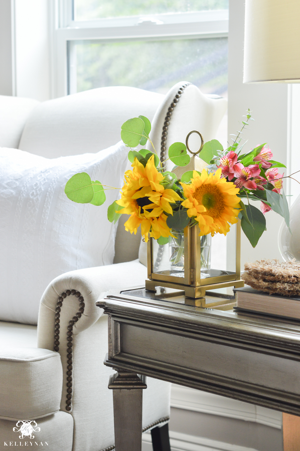 Floral Arrangement in Lantern- ideas for flower arranging with sunflowers and hydrangeas in gold lantern