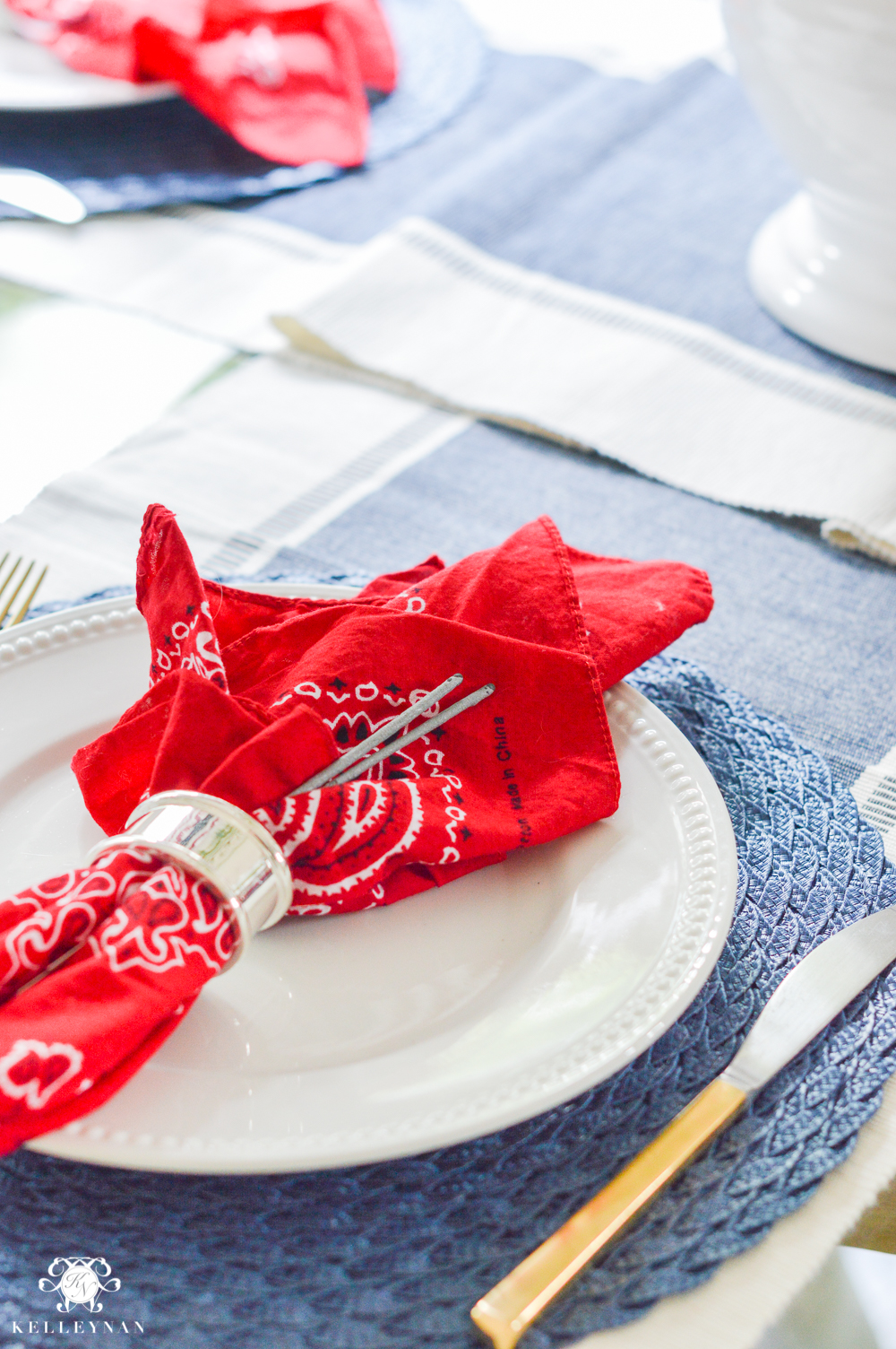 Fourth of July Decor bandanas as napkins with sparklers at place setting