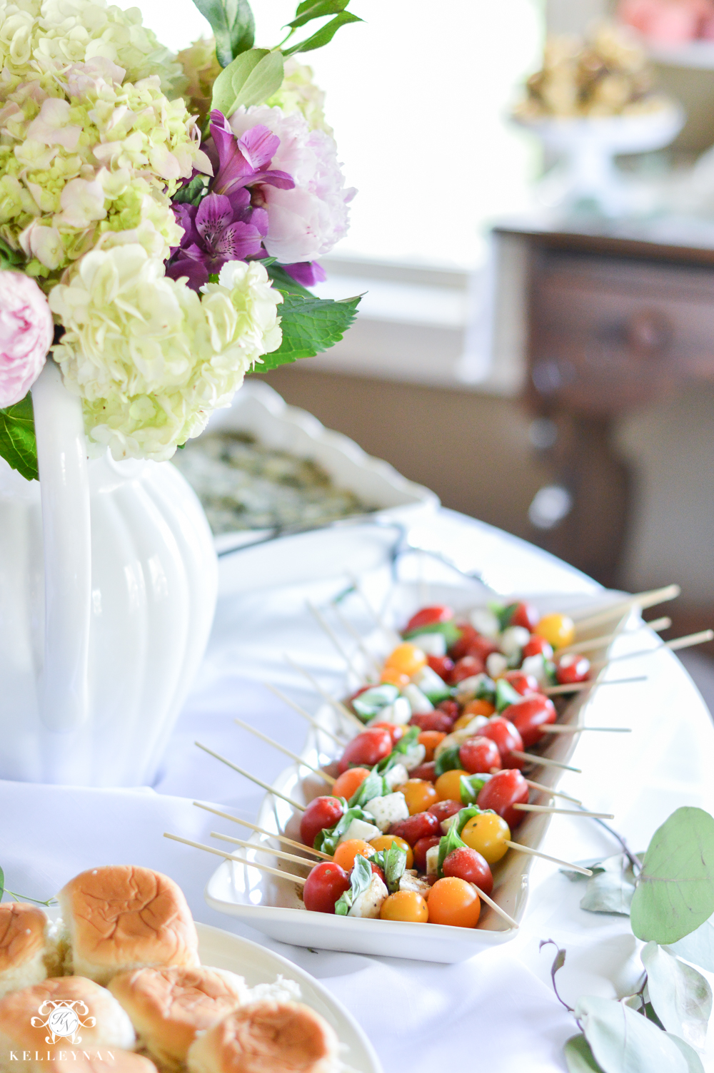 Southern Garden Party Bridal Shower Ideas- shower food table setup with caprese skewers