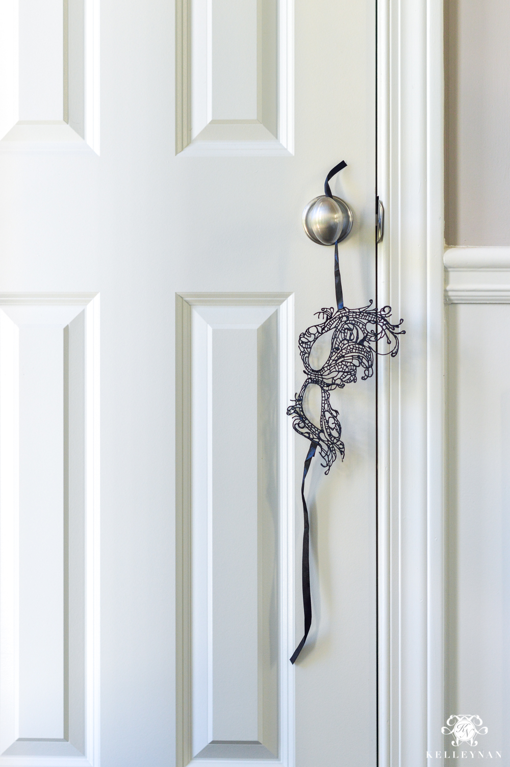 Masquerade Dinner Party for Halloween with Full Table Setting_-mask hanging from door knob