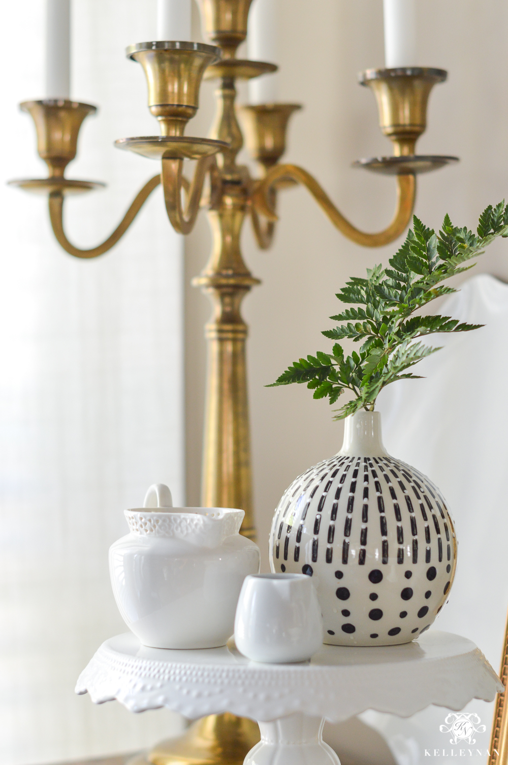 Sprig of greenery on buffet and cake stand