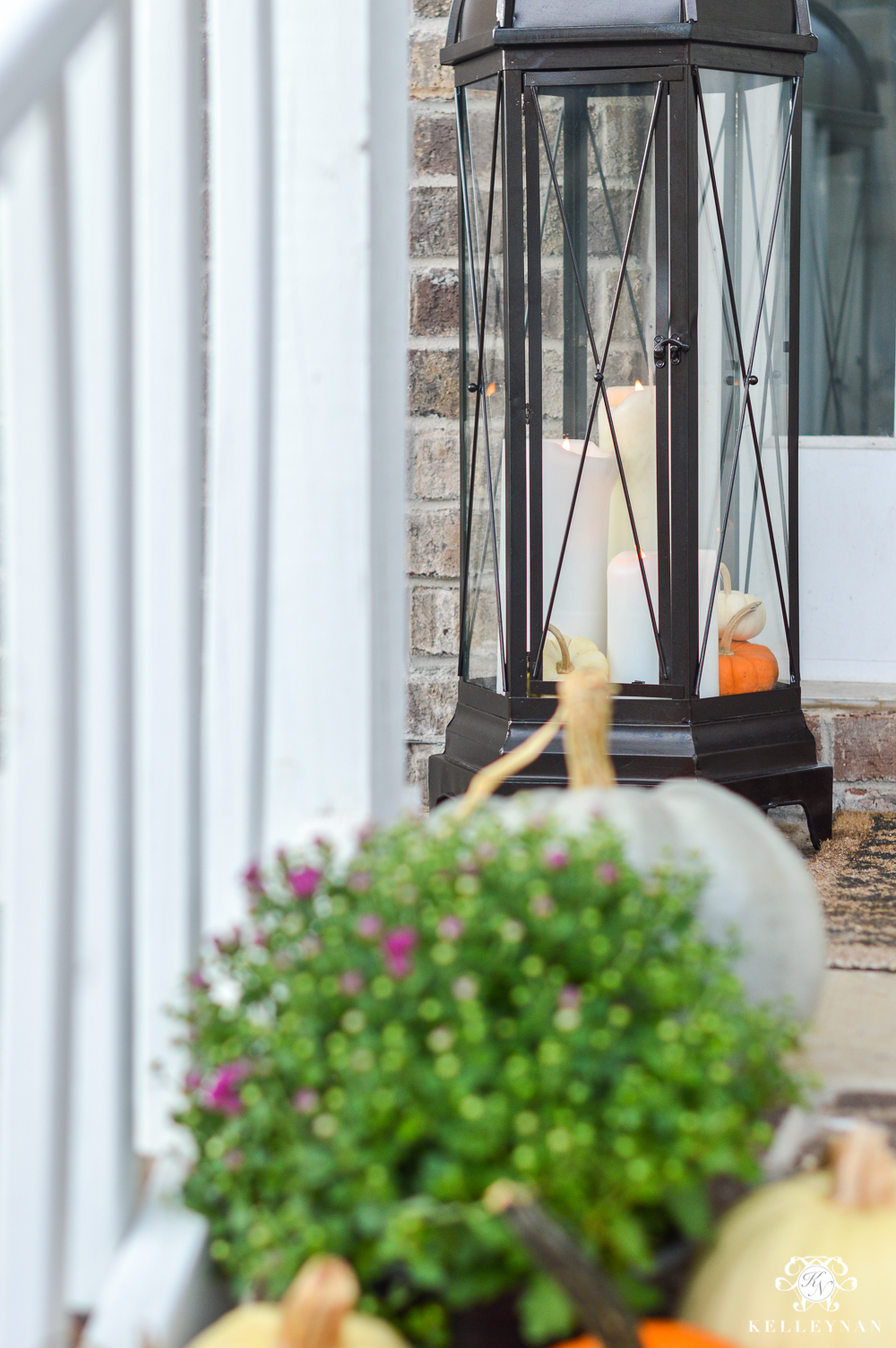 Large lanterns flanking fall front door