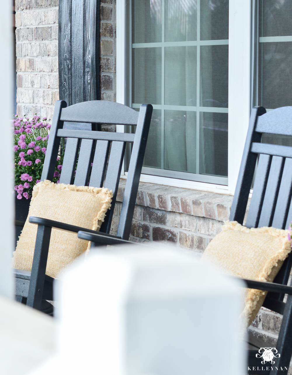 Black rocking chairs on fall front porch